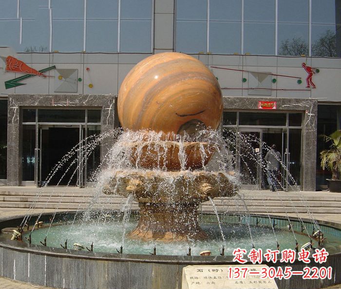 鹤壁石来运转球晚霞红风水球石雕