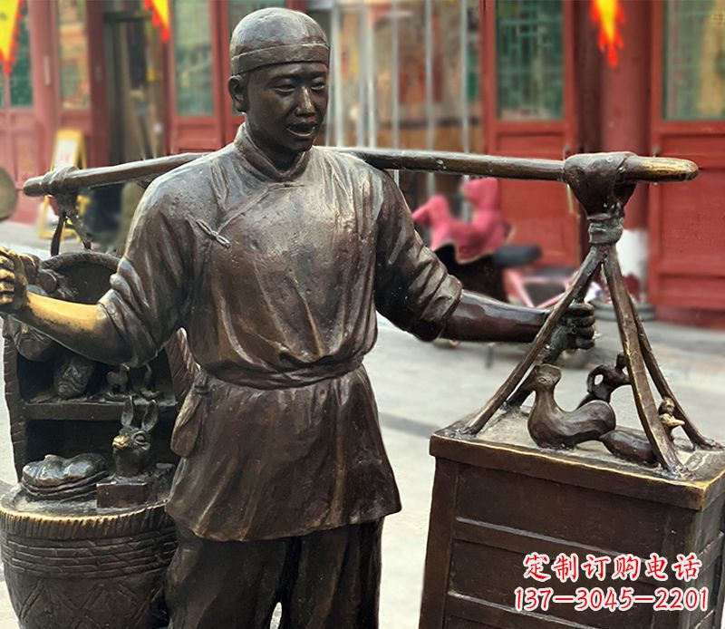 鹤壁铜雕步行街卖货郎人物雕塑