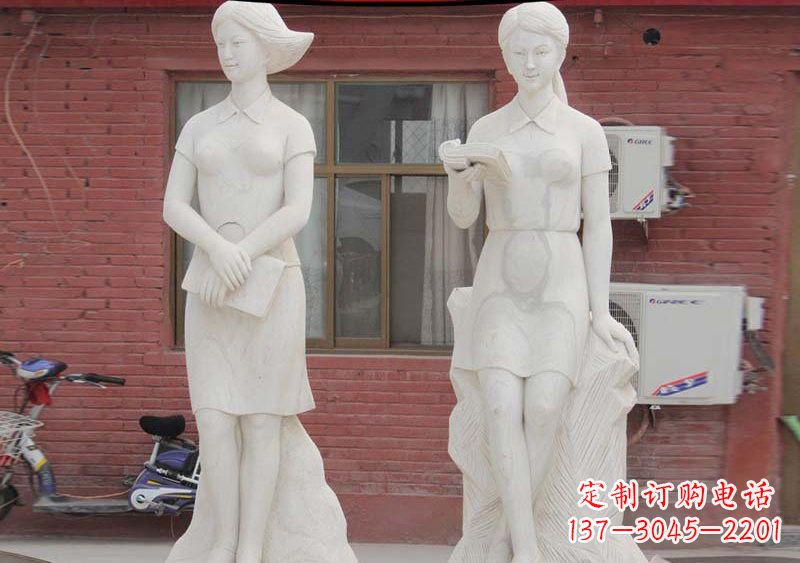 鹤壁校园拿书本的学生石雕