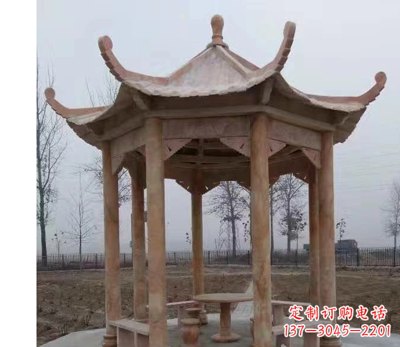 鹤壁公园晚霞红八角石雕凉亭